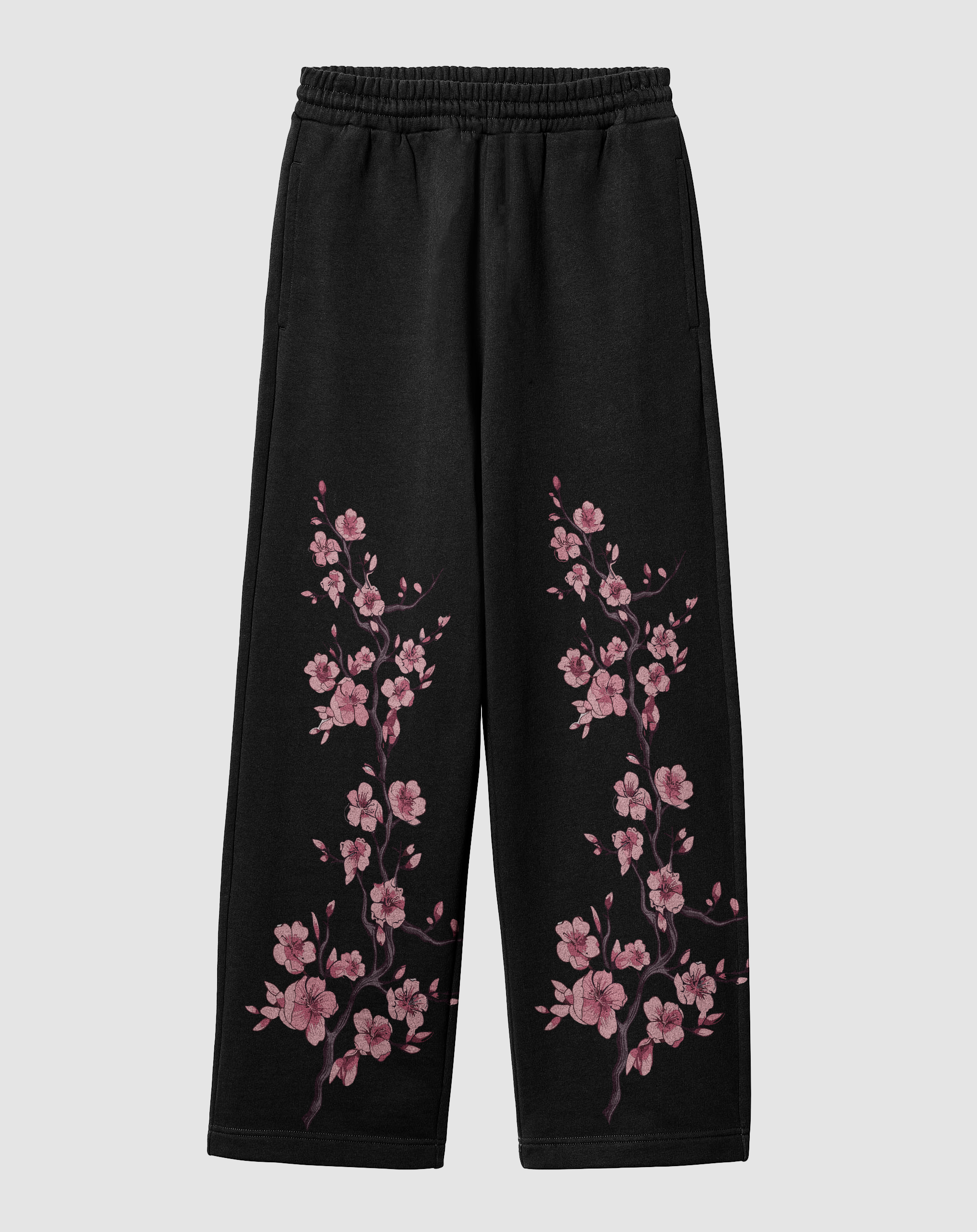 Sakura baskılı siyah motorcu eşofman altı, önden görünüm. İki paçada pembe sakura çiçeği baskısı